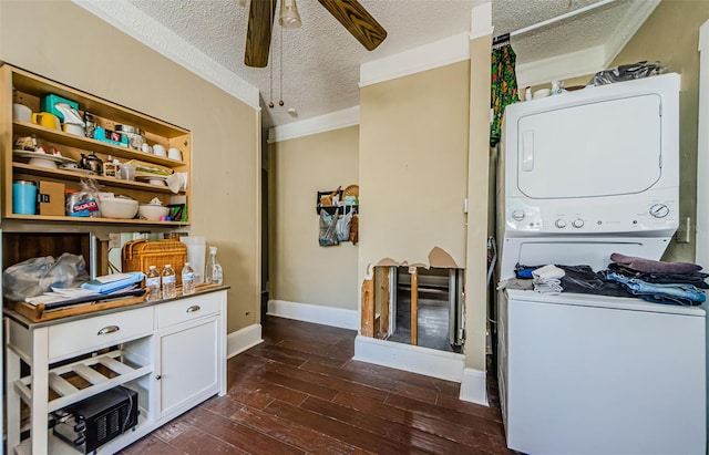 41 W Boyer St, Tarpon Springs, FL 34689 - laundry room with estacked washer and dryer, a ceiling fan, a textured ceiling, dark wood-style floors, and baseboards