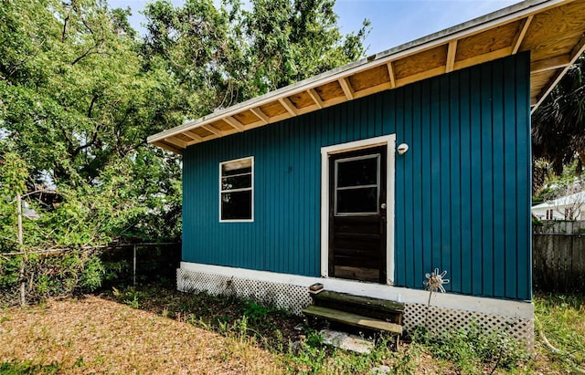 41 W Boyer St, Tarpon Springs, FL 34689 - view of outbuilding with entry steps, fence, and an outbuilding