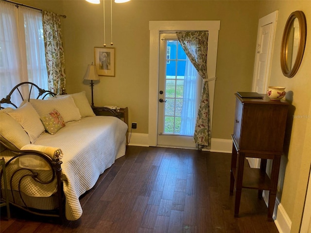 41 W Boyer St, Tarpon Springs, FL 34689 - bedroom with wood finished floors, baseboards, and access to exterior