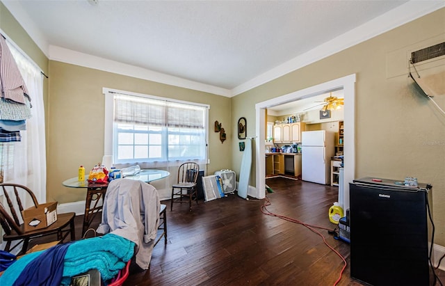 41 W Boyer St, Tarpon Springs, FL 34689 - dining space featuring dark wood-type flooring, ceiling fan, and baseboards