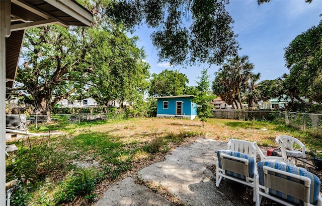 41 W Boyer St, Tarpon Springs, FL 34689 - fenced backyard with an outbuilding and a patio