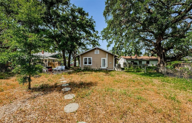 41 W Boyer St, Tarpon Springs, FL 34689 - rear view of property with a fenced backyard