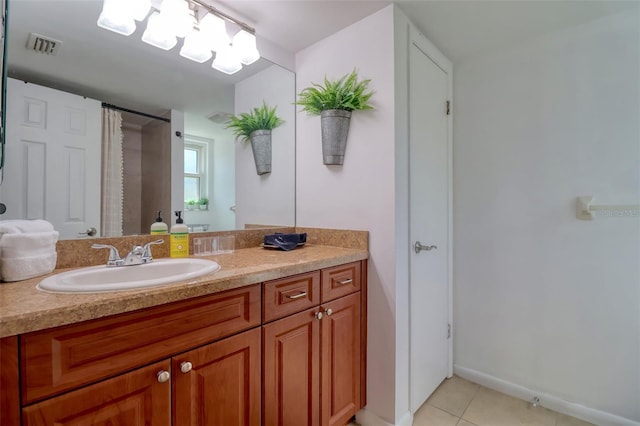 506 Summerwood Ct, Tarpon Springs, FL 34689 - full bath with vanity, tile patterned floors, a shower with shower curtain, and baseboards
