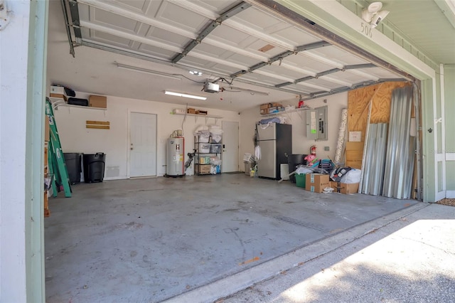 506 Summerwood Ct, Tarpon Springs, FL 34689 - garage featuring freestanding refrigerator, electric water heater, electric panel, and a garage door opener