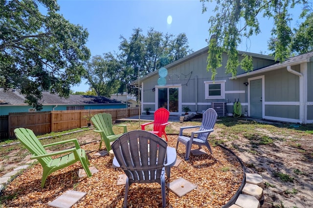 506 Summerwood Ct, Tarpon Springs, FL 34689 - view of yard featuring an outdoor fire pit, central air condition unit, and a patio