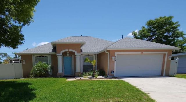 single story home featuring an attached garage, a shingled roof, a front lawn, stucco siding, and concrete driveway