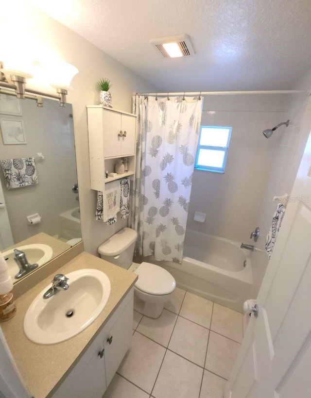 full bathroom with visible vents, shower / bath combo with shower curtain, toilet, a textured ceiling, and tile patterned floors