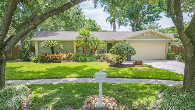 3714 Village Estates Pl, Tampa, FL 33618 - single story home with a front lawn, driveway, an attached garage, and fence