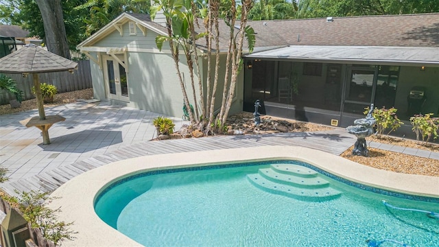 3714 Village Estates Pl, Tampa, FL 33618 - pool featuring a sunroom, a patio, french doors, and fence