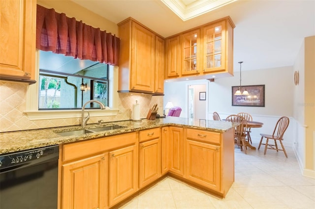 3714 Village Estates Pl, Tampa, FL 33618 - kitchen featuring glass insert cabinets, dishwasher, light stone counters, a sink, and a peninsula