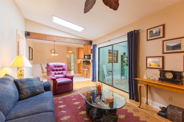 3714 Village Estates Pl, Tampa, FL 33618 - living area with a ceiling fan, light wood-style flooring, and lofted ceiling with skylight