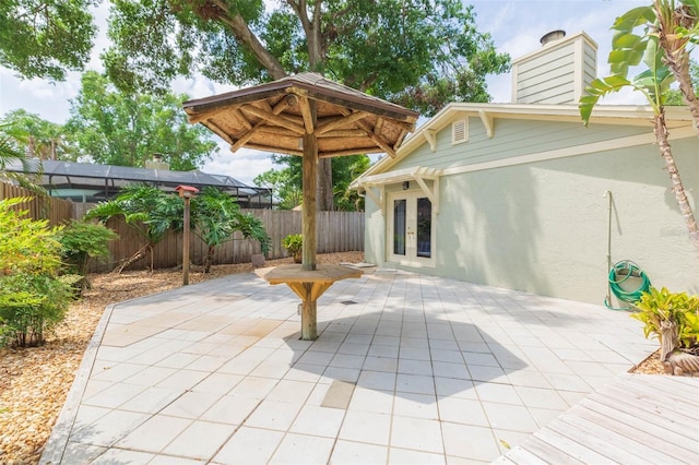 3714 Village Estates Pl, Tampa, FL 33618 - view of patio / terrace with a fenced backyard and french doors
