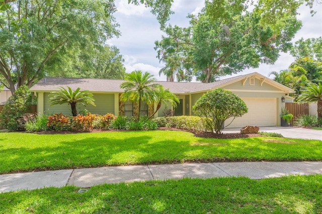 3714 Village Estates Pl, Tampa, FL 33618 - single story home with concrete driveway, a front yard, an attached garage, and fence