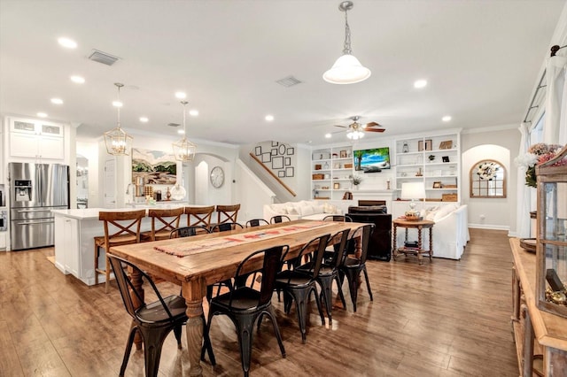 dining area with recessed lighting, a ceiling fan, wood finished floors, and ornamental molding