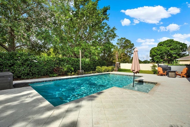 view of swimming pool with a fenced in pool, a fenced backyard, and a patio area