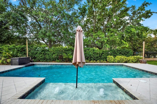 pool featuring a fenced backyard