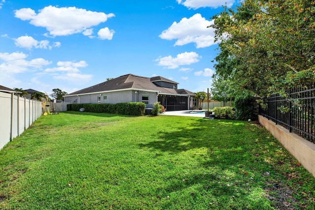 view of yard featuring a sunroom, a fenced backyard, and a fenced in pool