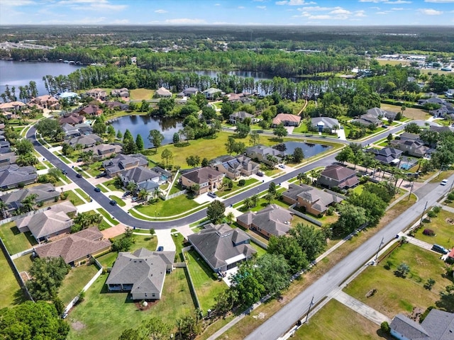 birds eye view of property with a residential view and a water view