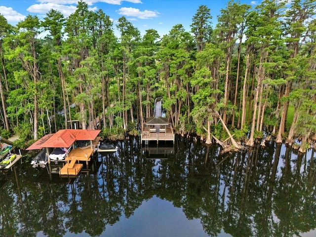 view of dock with boat lift and a water view