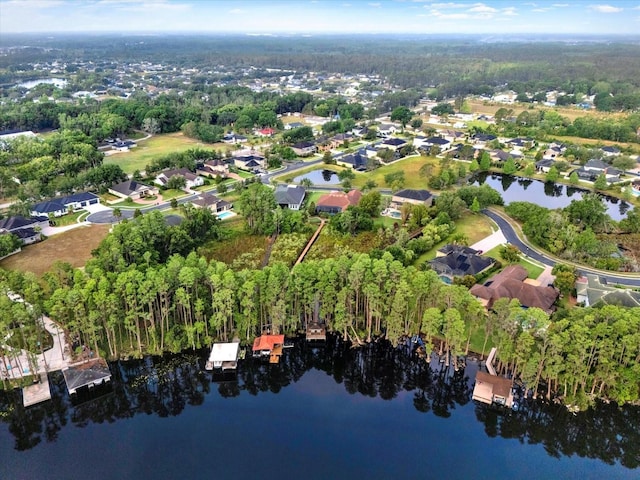 bird's eye view featuring a water view and a residential view