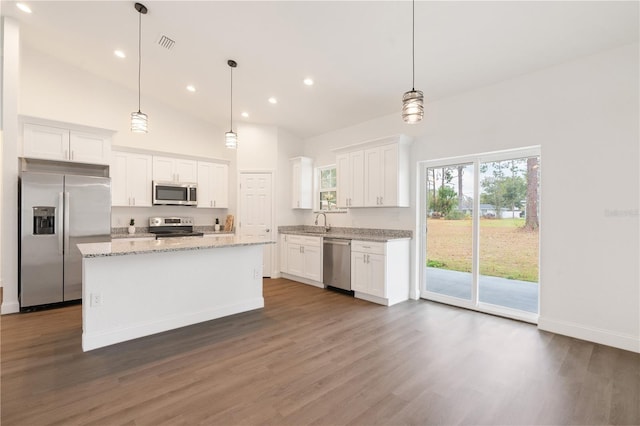 14404 SW 19th Pl, Ocala, FL 34481 - kitchen featuring appliances with stainless steel finishes, high vaulted ceiling, white cabinetry, and dark wood-type flooring