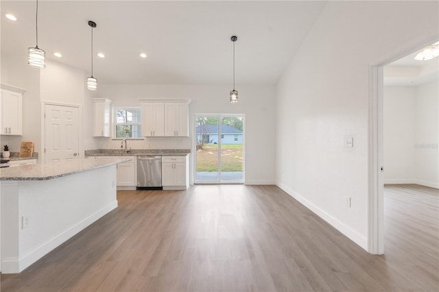 14404 SW 19th Pl, Ocala, FL 34481 - kitchen featuring light stone counters, white cabinets, light wood-style flooring, and dishwasher