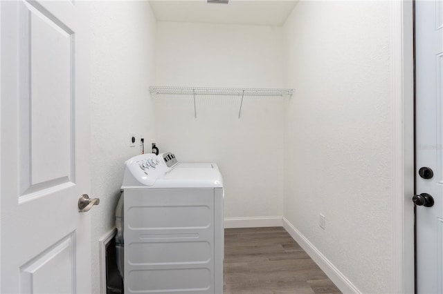 14404 SW 19th Pl, Ocala, FL 34481 - clothes washing area featuring light wood-style floors, baseboards, laundry area, and washing machine and clothes dryer