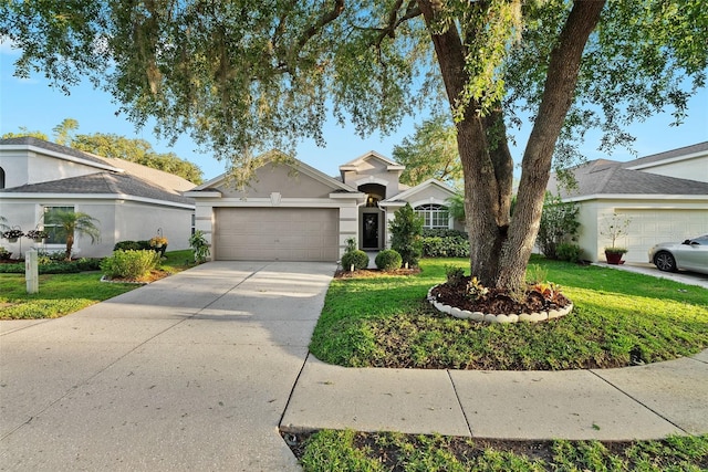 view of front of home featuring an attached garage, stucco siding, a front yard, and concrete driveway