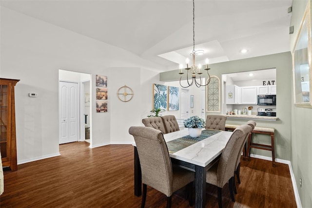 dining area featuring an inviting chandelier, baseboards, recessed lighting, and dark wood-type flooring