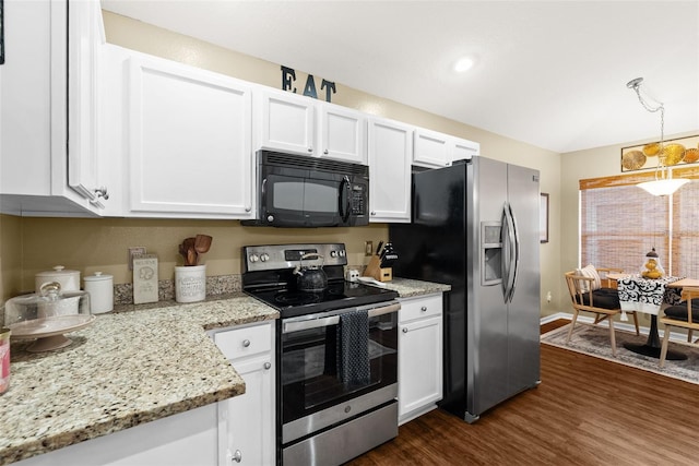 kitchen featuring light stone counters, white cabinets, stainless steel appliances, and dark wood-style floors