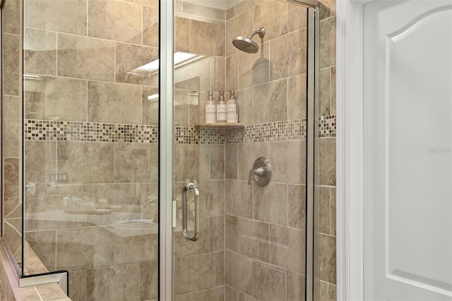 bathroom featuring a shower stall