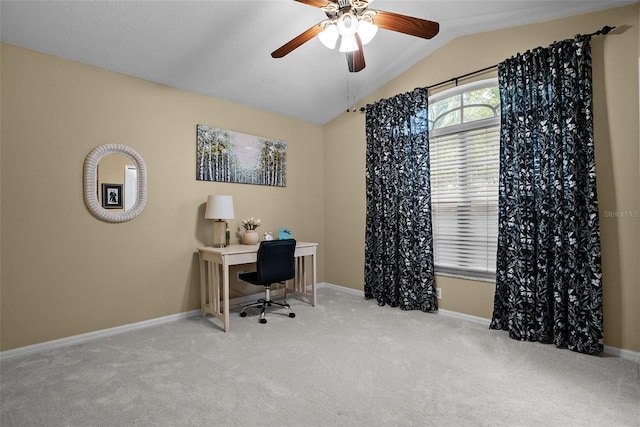 home office featuring carpet floors, ceiling fan, vaulted ceiling, and baseboards