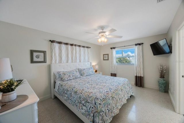 bedroom with baseboards, ceiling fan, and light speckled floor