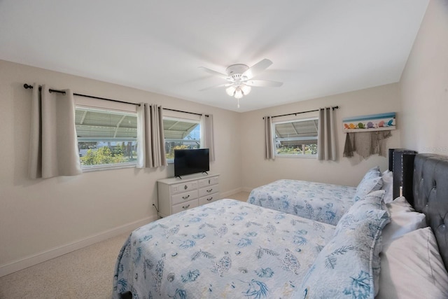 bedroom with baseboards, a ceiling fan, and carpet floors