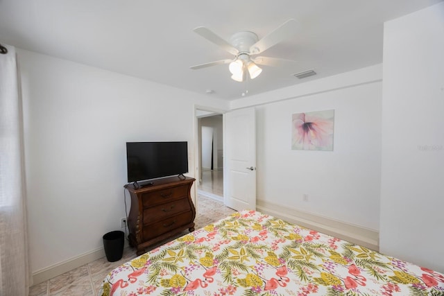 bedroom with a ceiling fan, baseboards, and visible vents