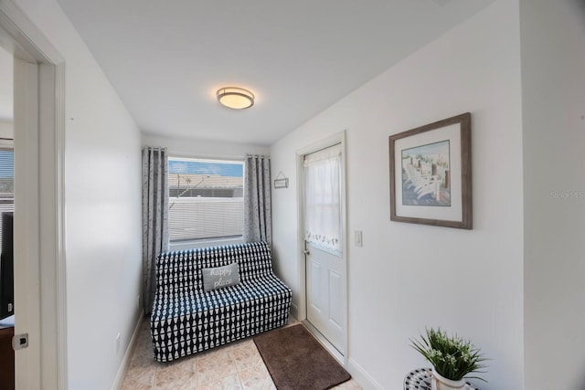 interior space featuring baseboards