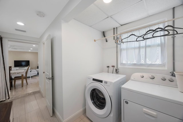 clothes washing area with laundry area, visible vents, baseboards, recessed lighting, and washer and clothes dryer