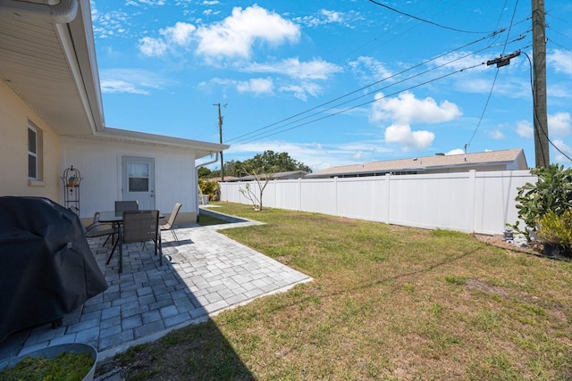 view of yard with fence and a patio area