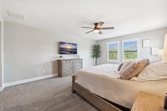 bedroom with visible vents, carpet flooring, baseboards, and ceiling fan