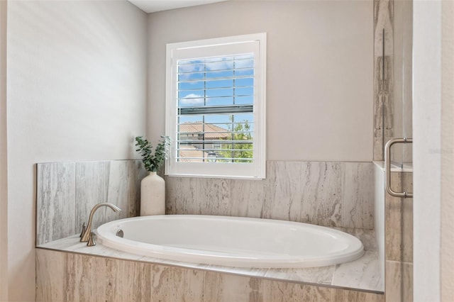 full bathroom with a garden tub and an enclosed shower