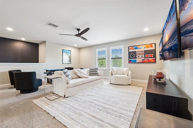 living room featuring carpet, recessed lighting, a ceiling fan, baseboards, and visible vents