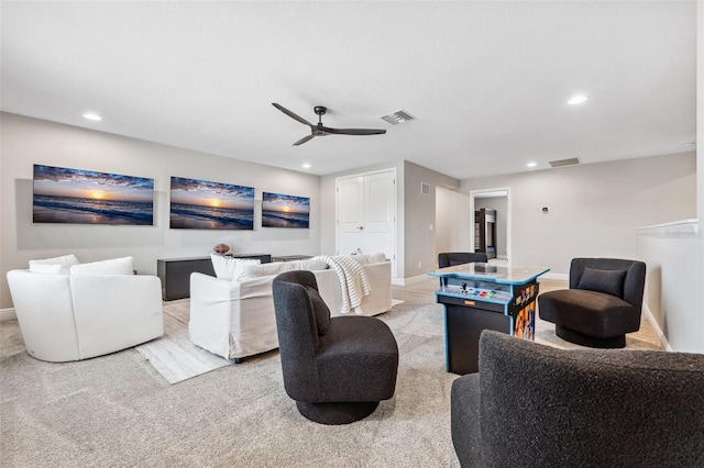 cinema room featuring visible vents, recessed lighting, carpet, and a ceiling fan