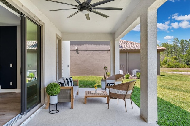 view of patio / terrace featuring ceiling fan and central AC