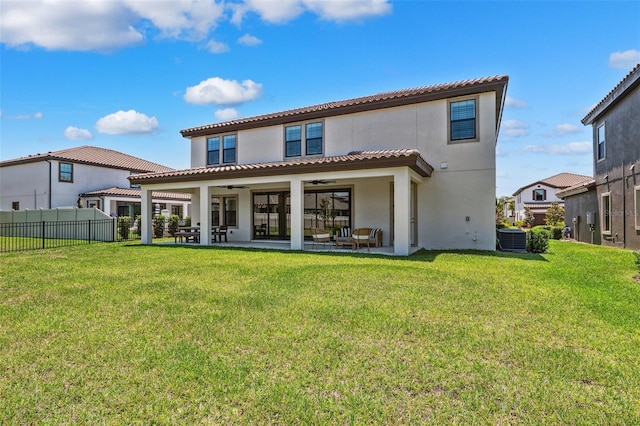 rear view of property with fence, ceiling fan, stucco siding, cooling unit, and a patio