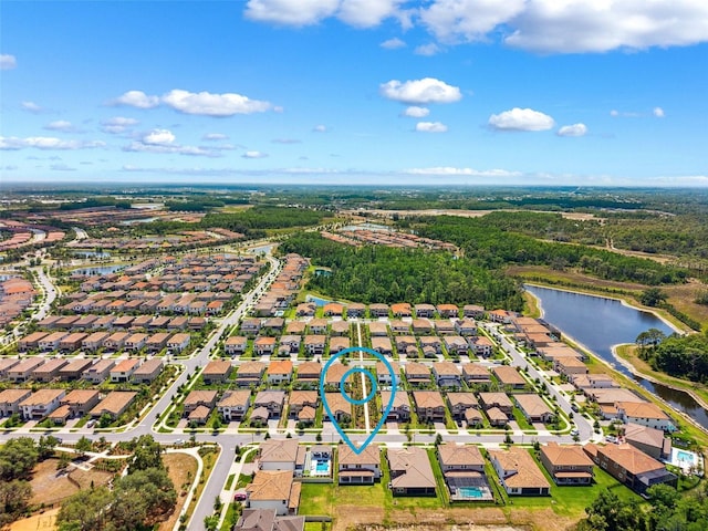 aerial view with a residential view and a water view