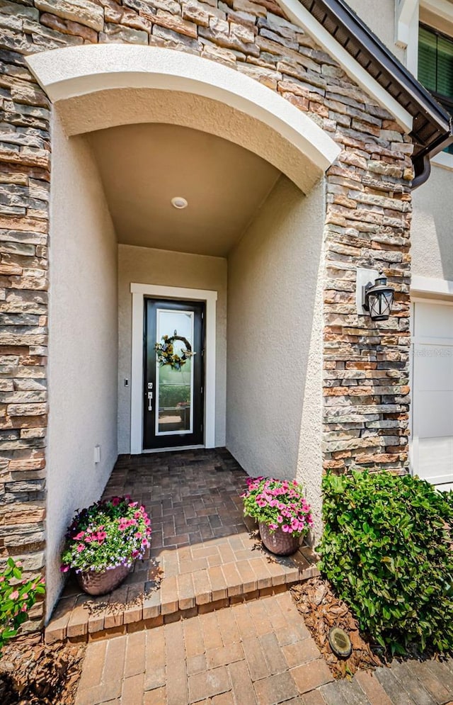 2653 Longleaf Pine Pt, New Port Richey, FL 34655 - doorway to property with stone siding and stucco siding
