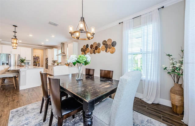2653 Longleaf Pine Pt, New Port Richey, FL 34655 - dining area with ornamental molding, a chandelier, wood finished floors, and recessed lighting