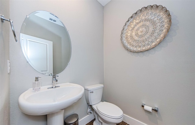 2653 Longleaf Pine Pt, New Port Richey, FL 34655 - half bathroom featuring toilet and baseboards