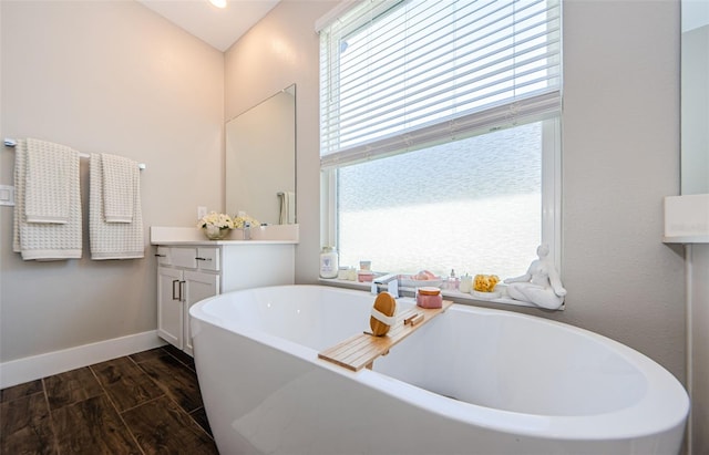 2653 Longleaf Pine Pt, New Port Richey, FL 34655 - full bathroom featuring a soaking tub, healthy amount of natural light, vanity, and wood finished floors