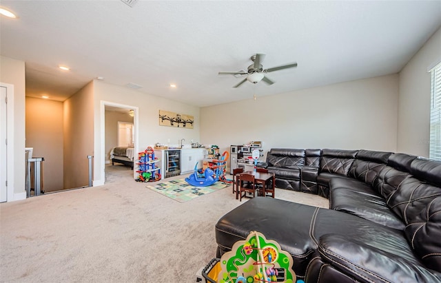 2653 Longleaf Pine Pt, New Port Richey, FL 34655 - carpeted living room featuring a ceiling fan, recessed lighting, and wine cooler